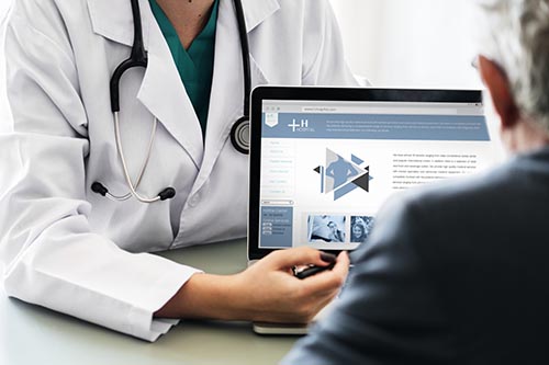 Doctor suggesting hospital program to patient Doctor suggesting hospital program to patient