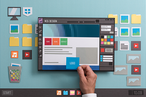 Web design software Web designer drafting web templates and web page layouts using a professional software, collage and paper cut composition